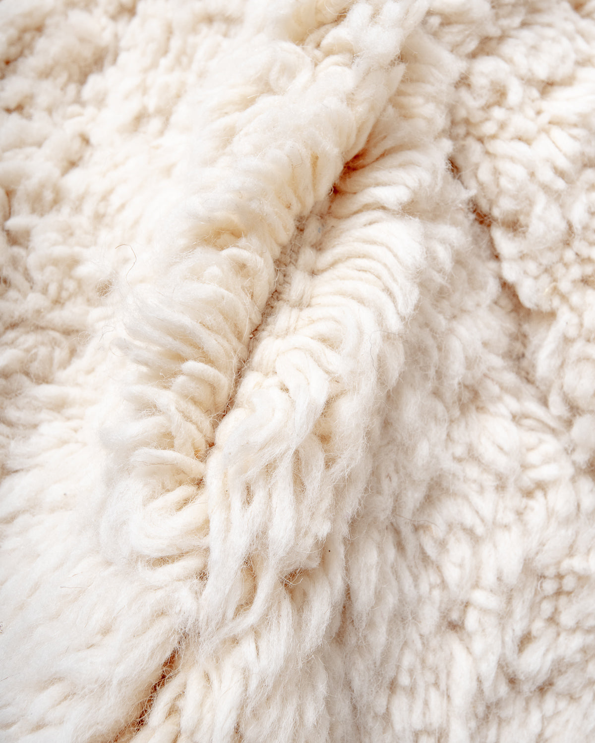 Modern, designer, handcrafted Berber rug from Morocco. Beniourain carpet with minimalist design, natural wool pile and a fluffy texture.