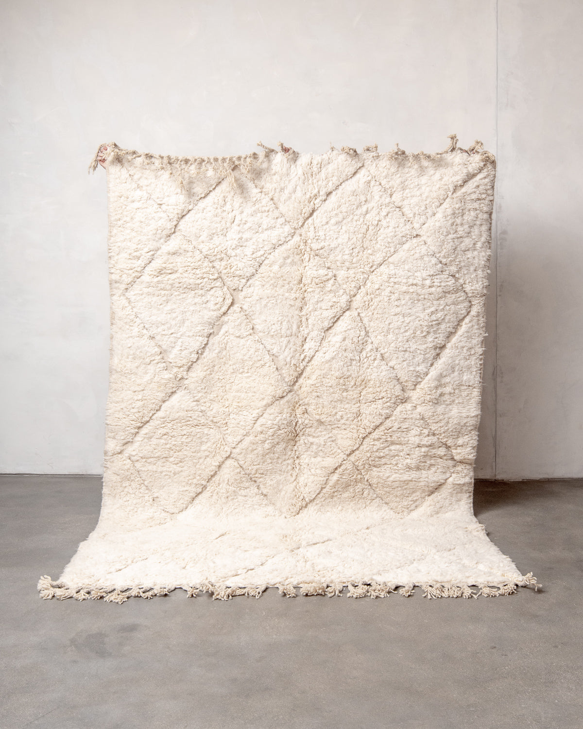 Modern, designer, handcrafted Berber rug from Morocco. Beniourain carpet with minimalist design, natural wool pile and a fluffy texture.