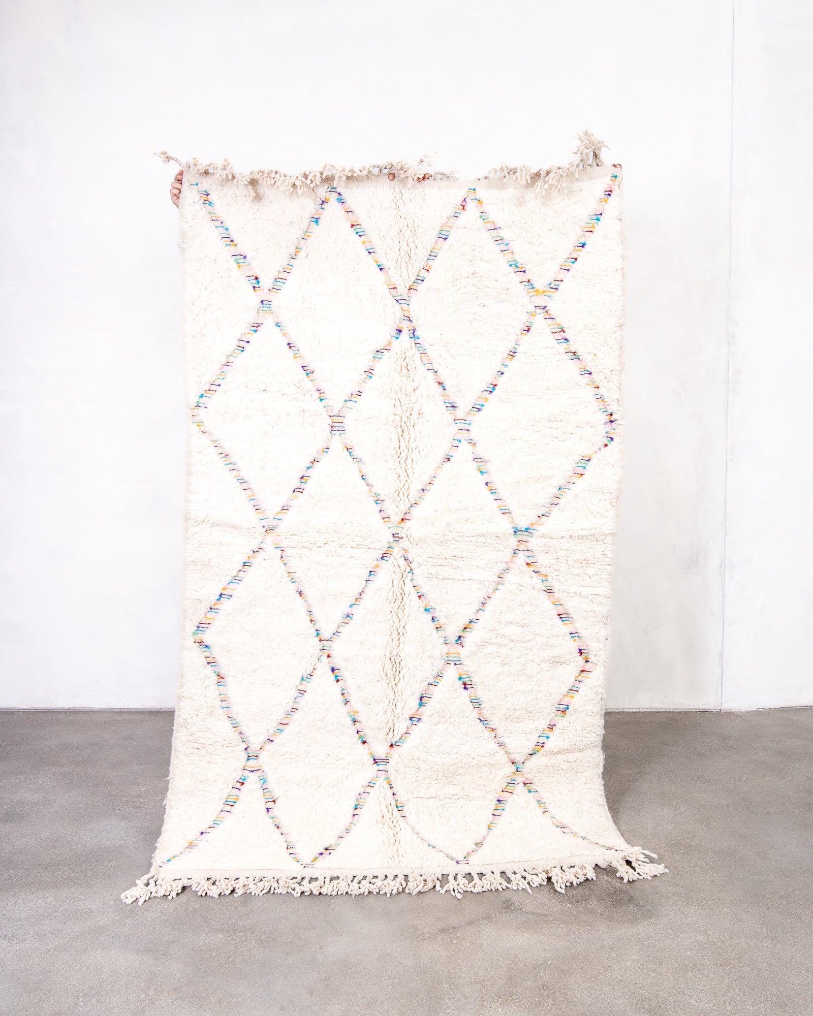 Modern, designer, handcrafted Berber rug from Morocco. Beniourain carpet with beautiful colours and patterns and fluffy wool texture.