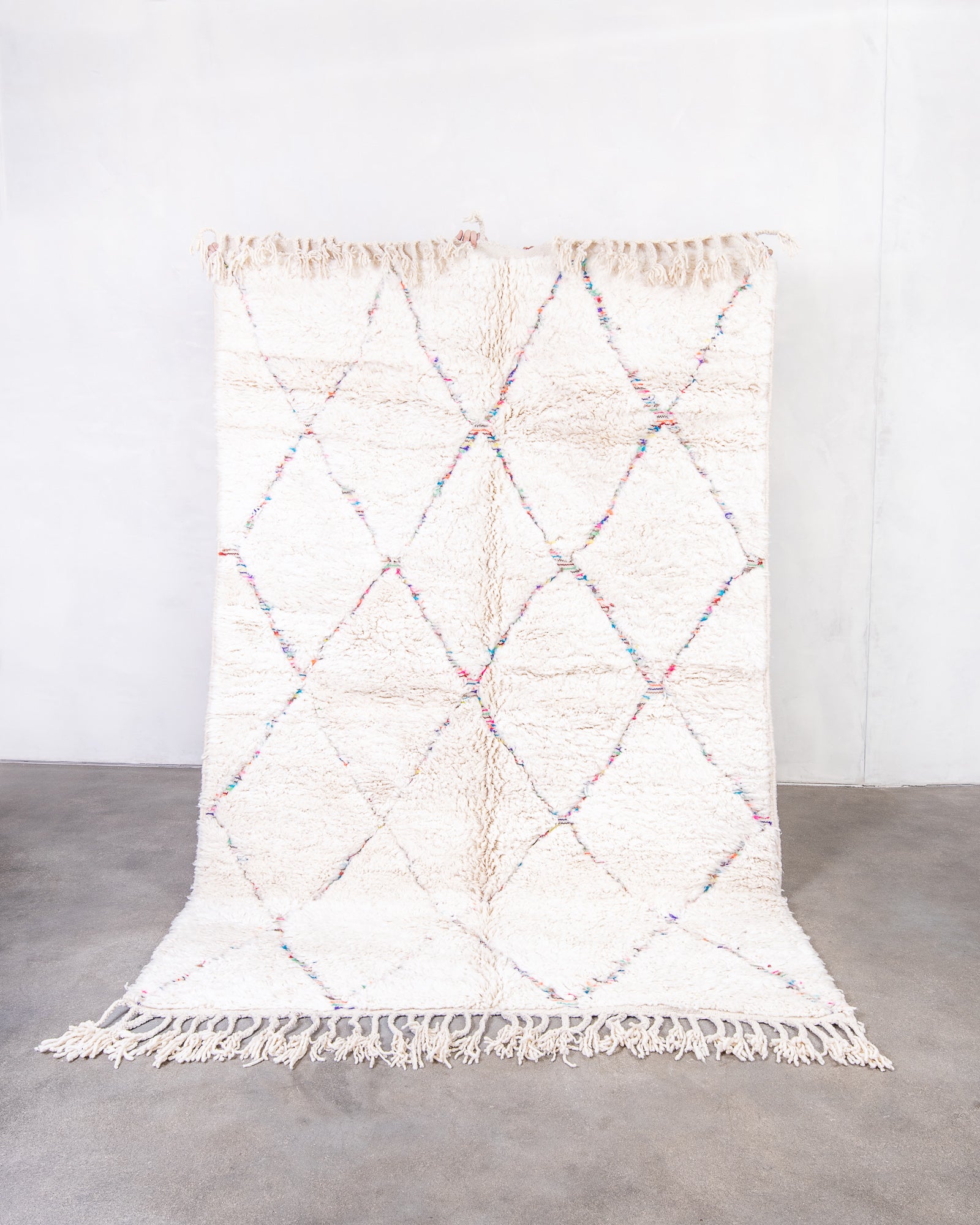 Modern, designer, handcrafted Berber rug from Morocco. Beniourain carpet with beautiful colours and patterns and fluffy wool texture.