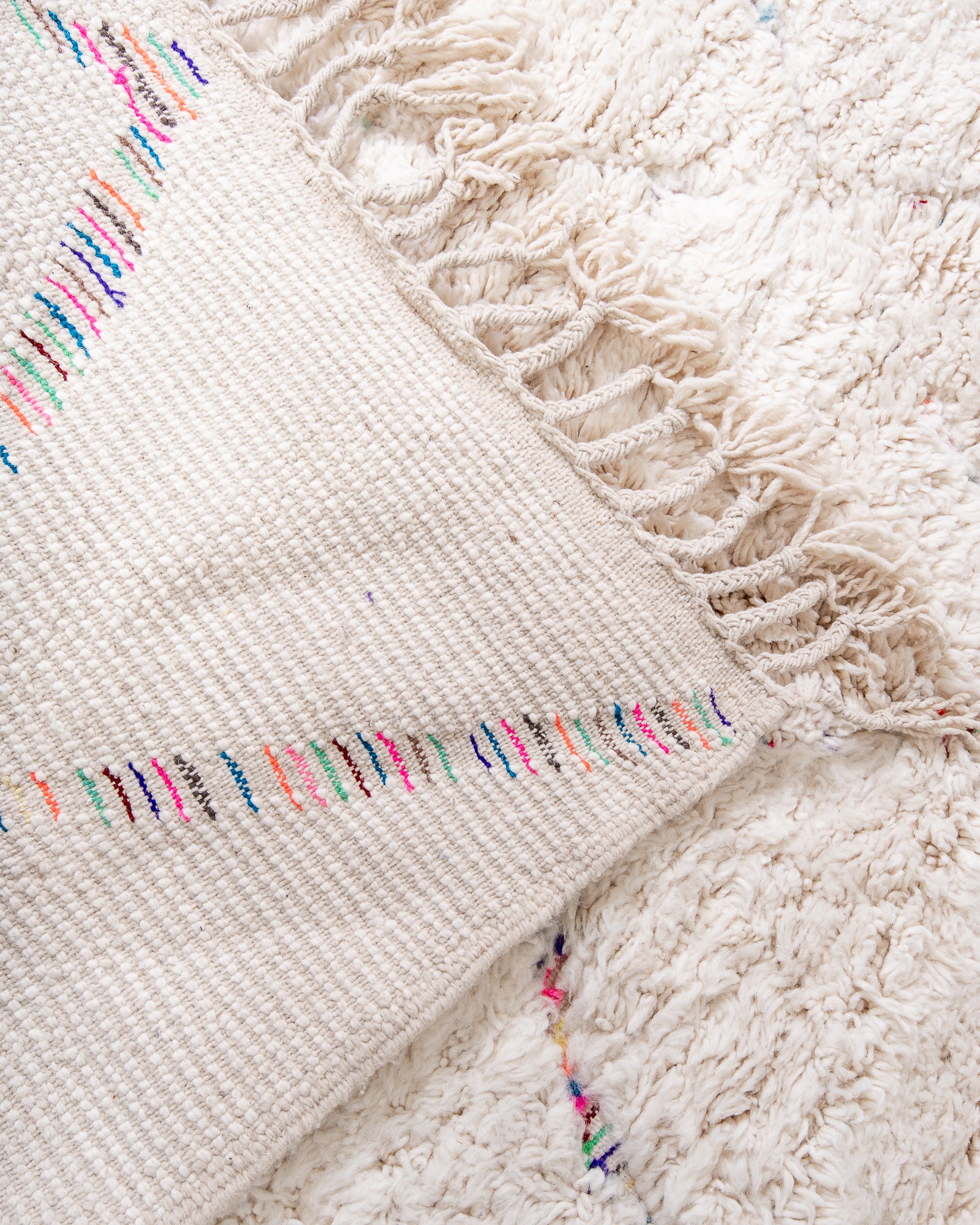 Modern, designer, handcrafted Berber rug from Morocco. Beniourain carpet with beautiful colours and patterns and fluffy wool texture.