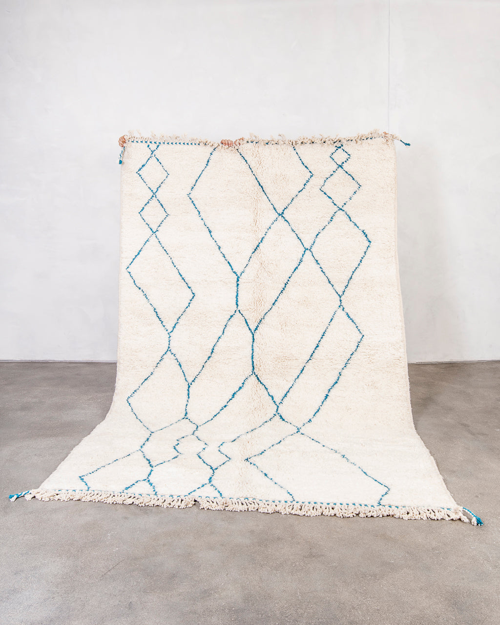 Modern, designer, handcrafted Berber rug from Morocco. Beniourain carpet with beautiful colors and patterns and fluffy wool texture.