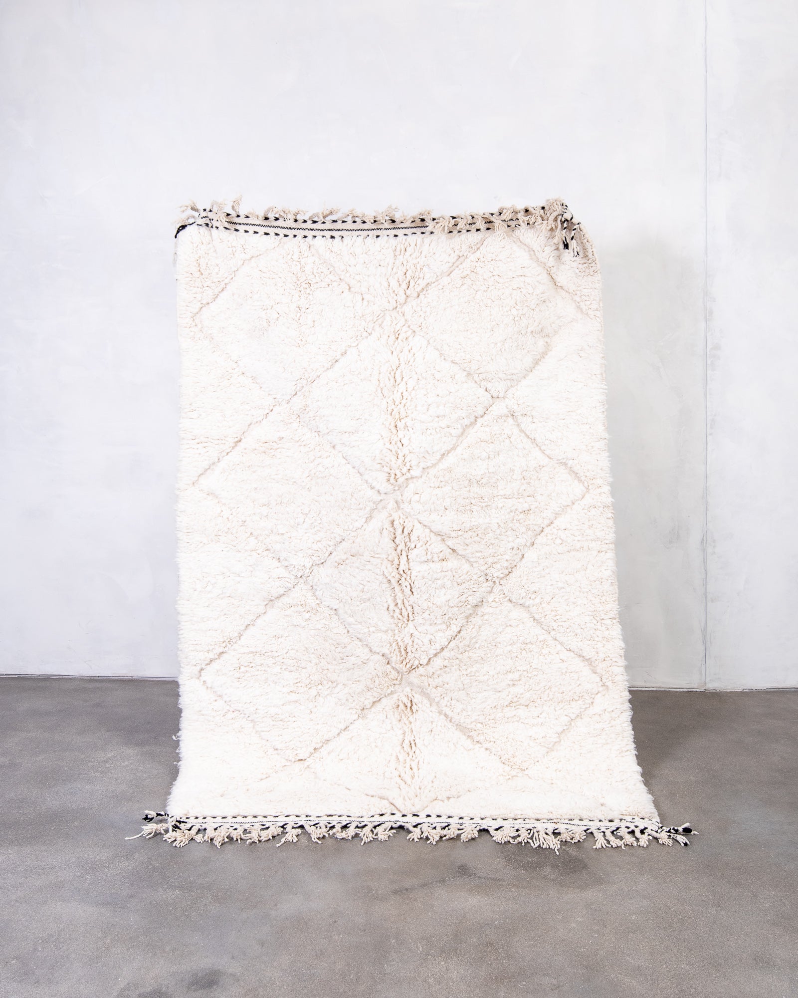 Modern, designer, handcrafted Berber rug from Morocco. Beniourain carpet with beautiful colours and patterns and fluffy wool texture.