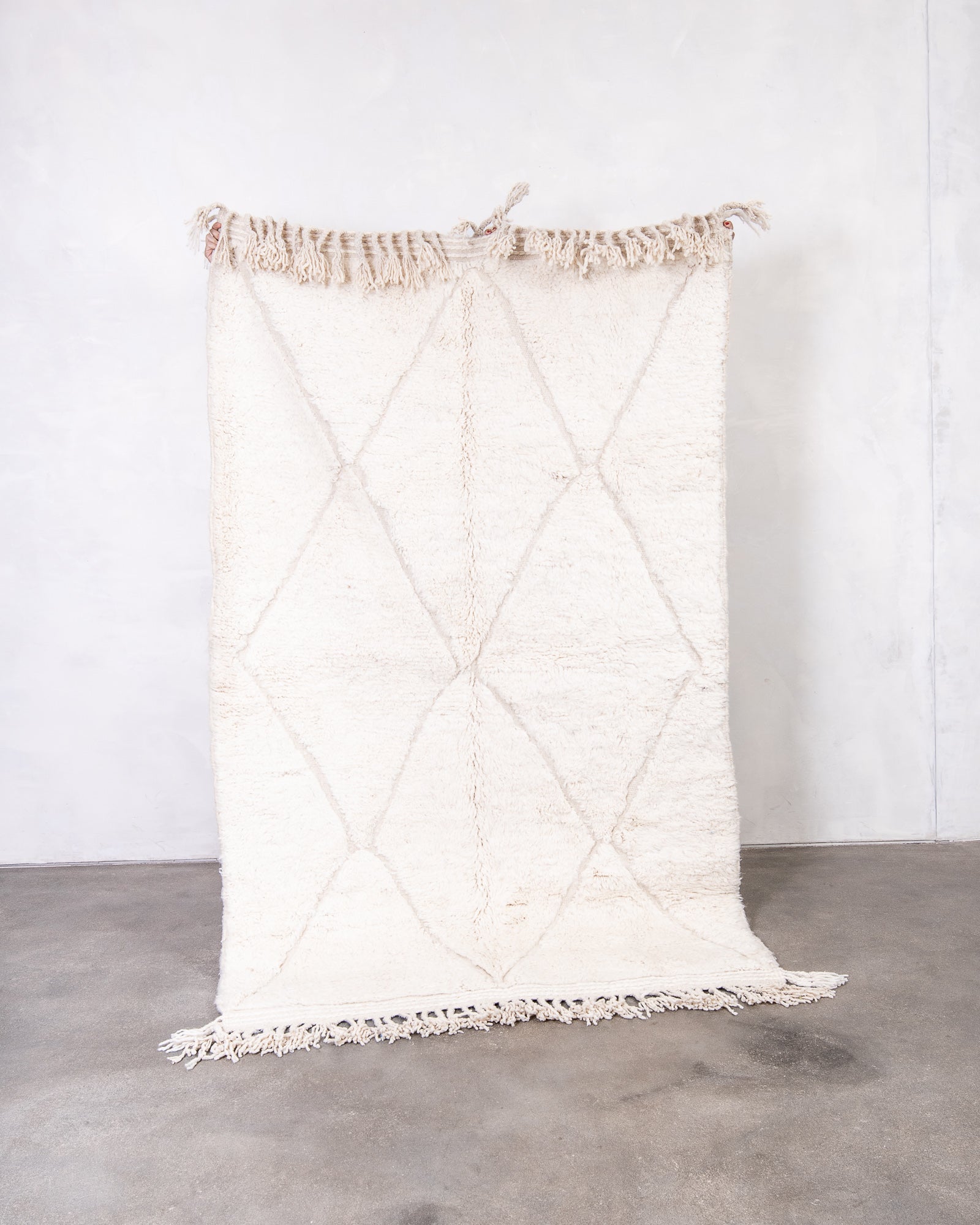 Modern, designer, handcrafted Berber rug from Morocco. Beniourain carpet with beautiful colours and patterns and fluffy wool texture.