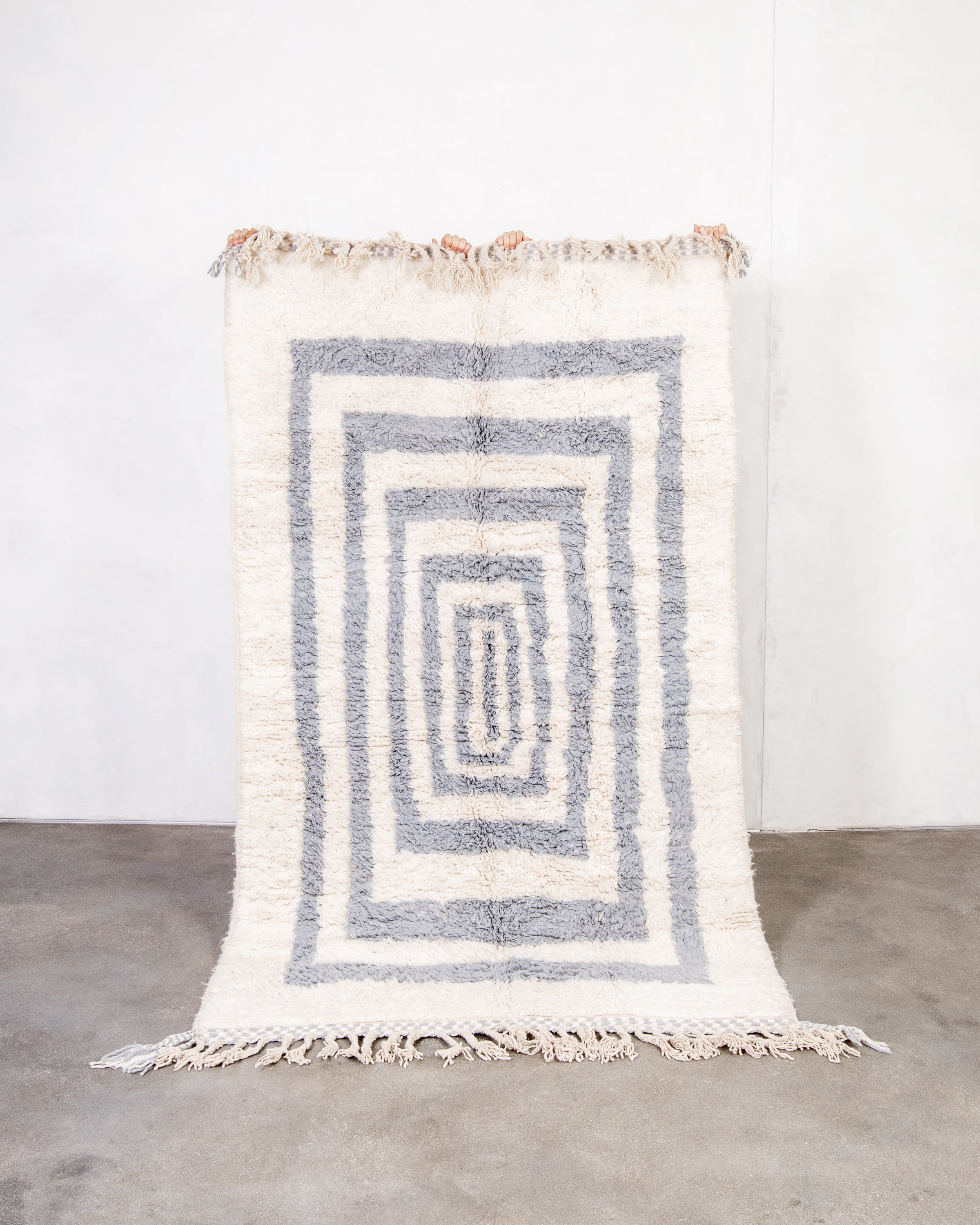 Modern, designer, handcrafted Berber rug from Morocco. Beniourain carpet with beautiful colors and patterns and fluffy wool texture.