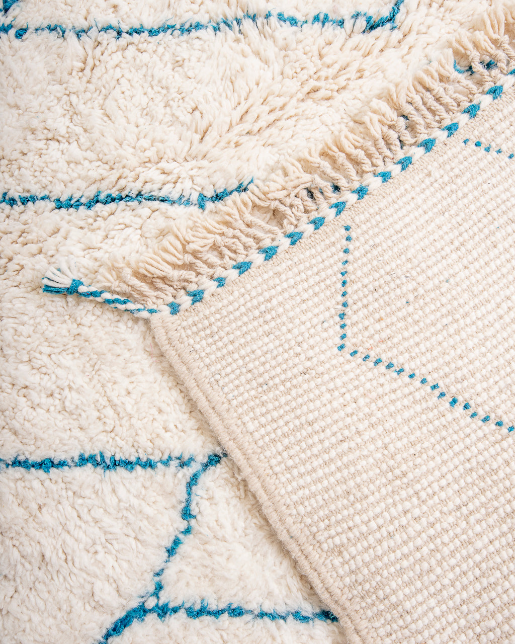 Modern, designer, handcrafted Berber rug from Morocco. Beniourain carpet with beautiful colors and patterns and fluffy wool texture.