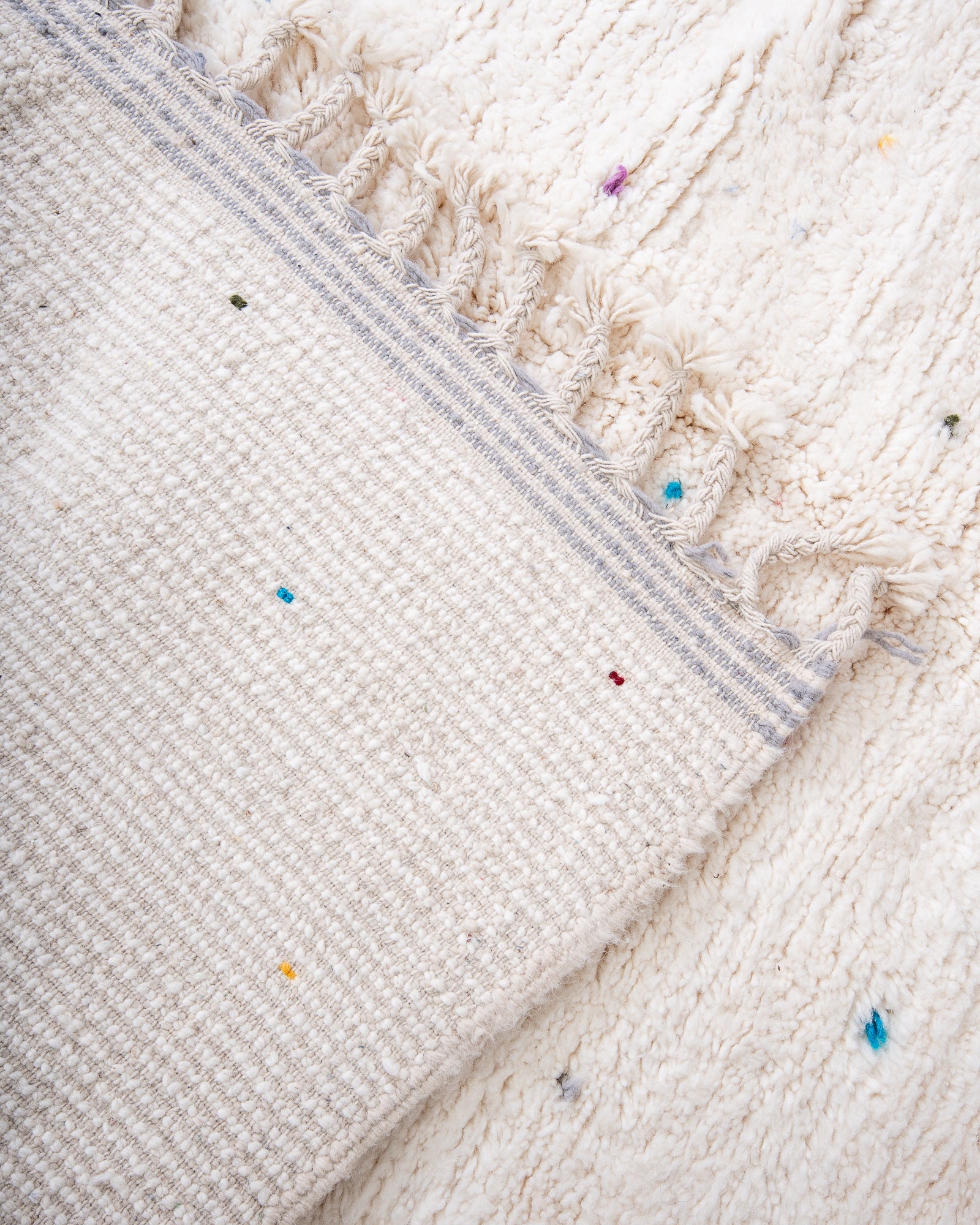 Modern, designer, handcrafted Berber rug from Morocco. Beniourain carpet with beautiful colours and patterns and fluffy wool texture.