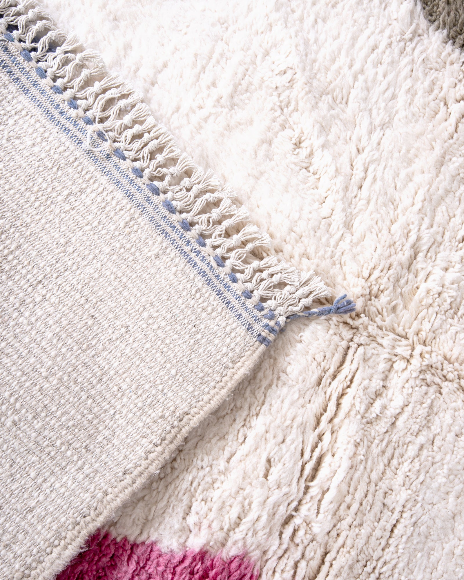 Modern, designer, handcrafted Berber rug from Morocco. Beniourain carpet with beautiful colors and patterns and fluffy wool texture.