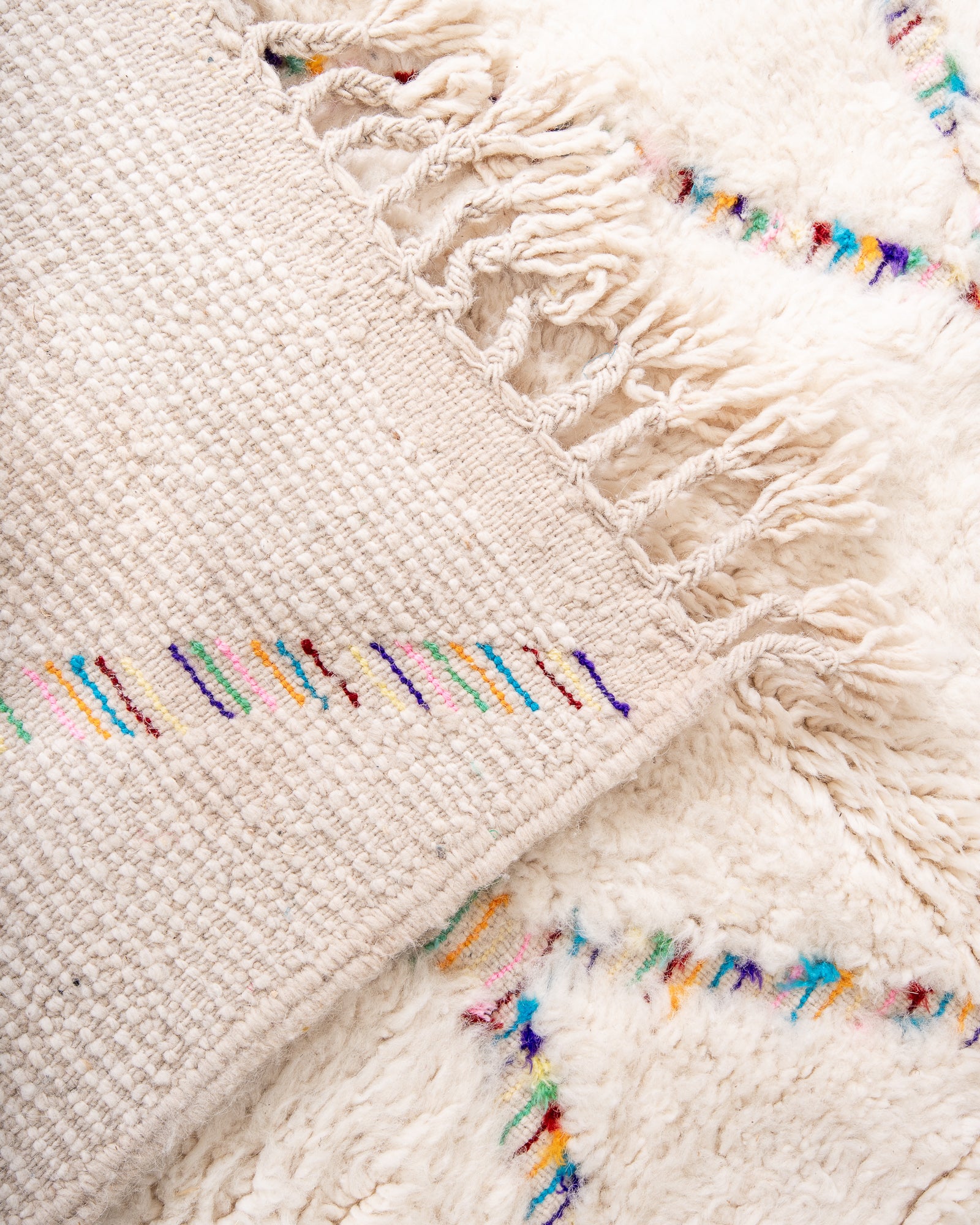 Modern, designer, handcrafted Berber rug from Morocco. Beniourain carpet with beautiful colours and patterns and fluffy wool texture.