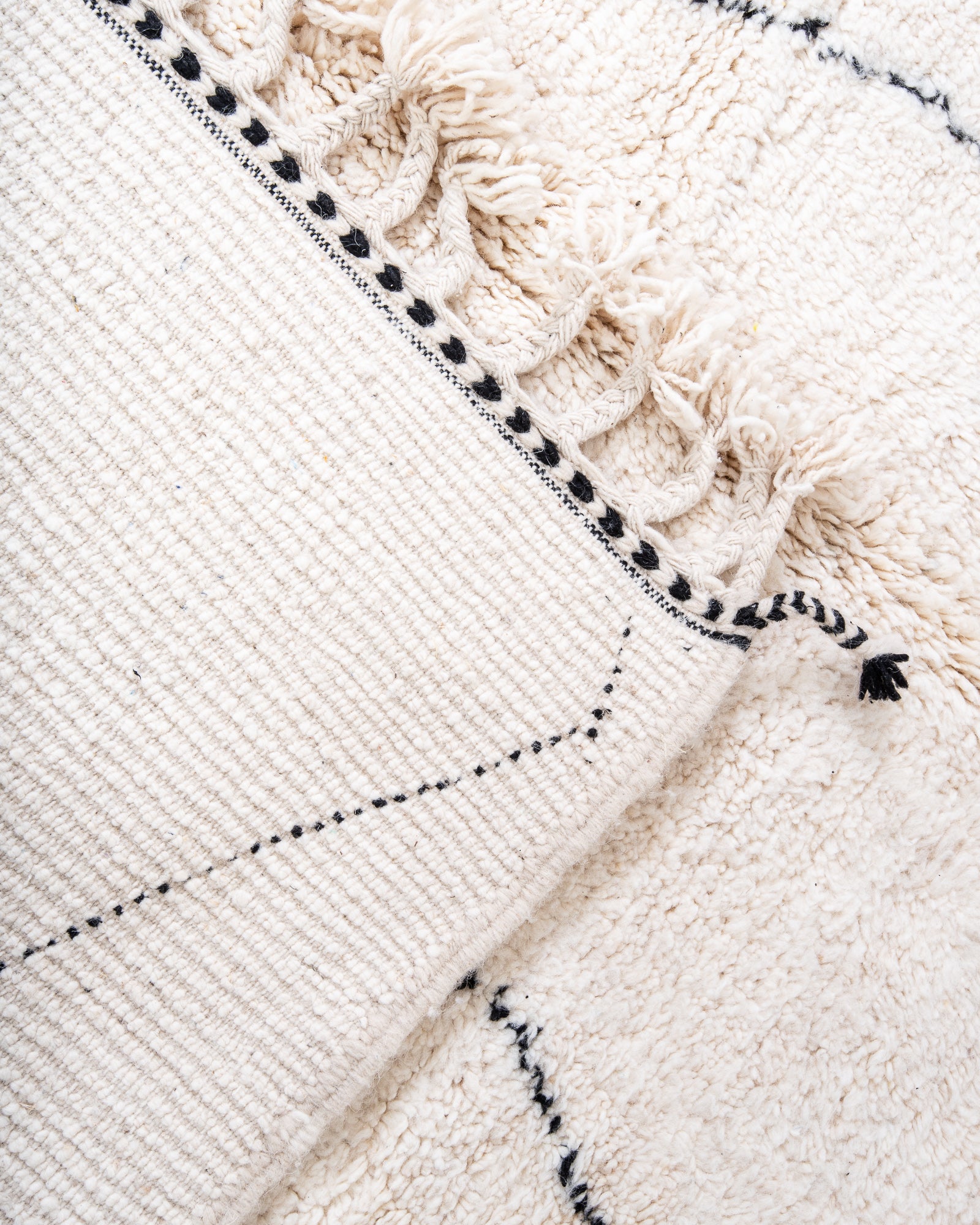 Modern, designer, handcrafted Berber rug from Morocco. Beniourain carpet with beautiful colours and patterns and fluffy wool texture.