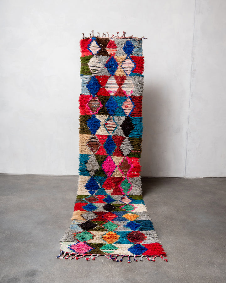 Modern designer vintage handcrafted cotton Berber rug from Morocco. Boucherouite with beautiful colors and patterns.