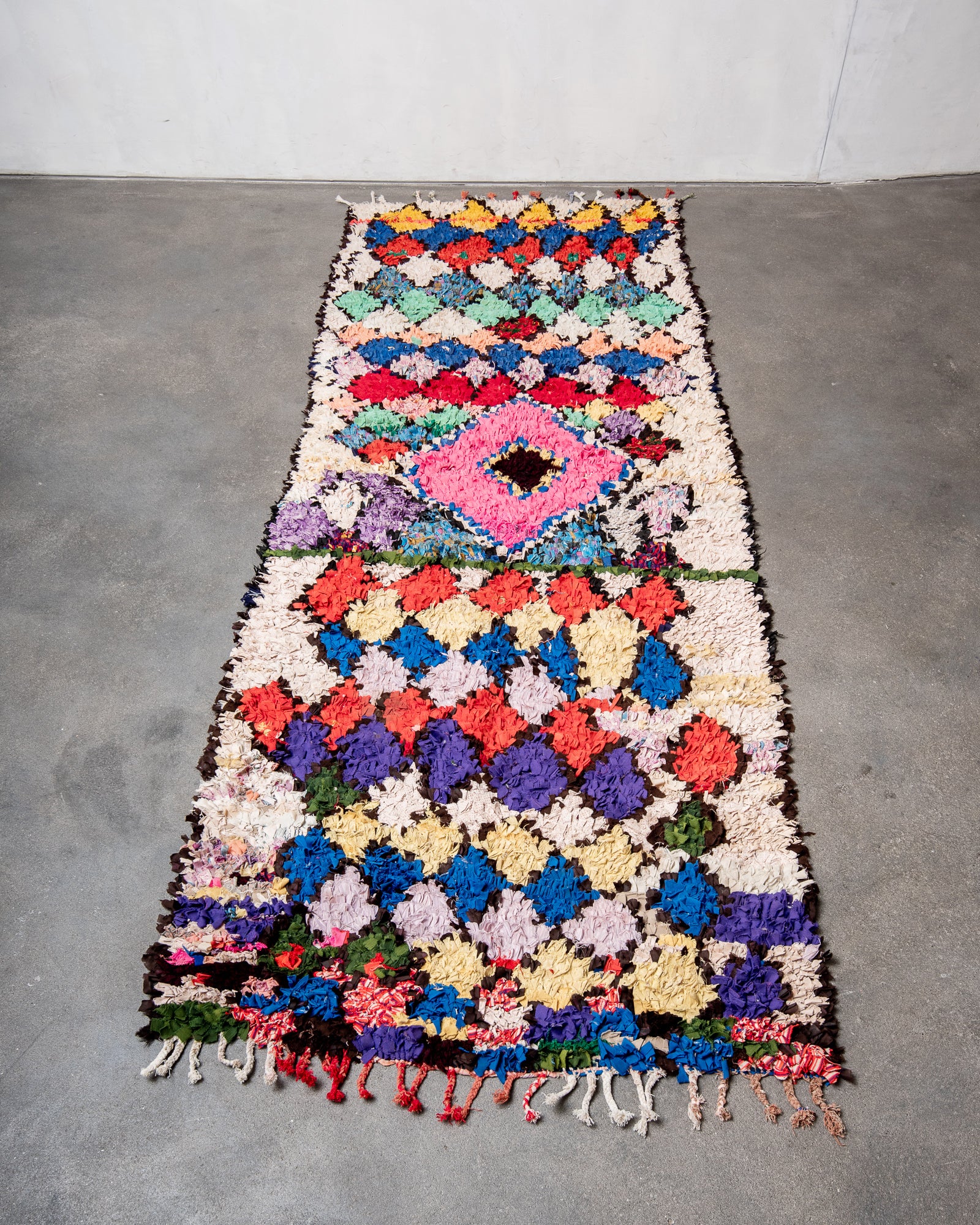 Modern designer vintage handcrafted cotton Berber rug from Morocco. Boucherouite with beautiful colors and patterns.