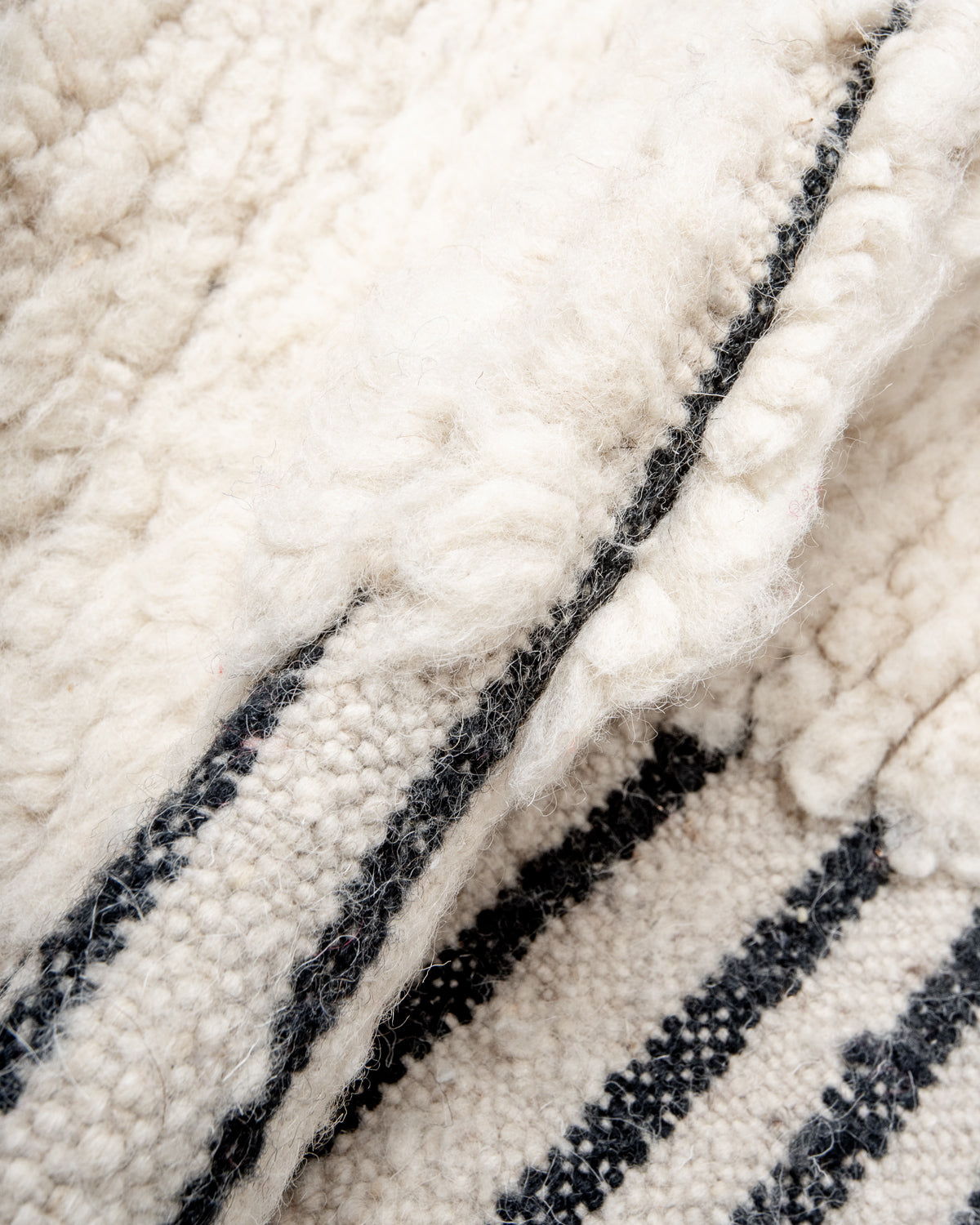 Modern, designer, handcrafted Berber runner rug from Morocco. Beniourain carpet with beautiful colours and patterns and fluffy wool texture.