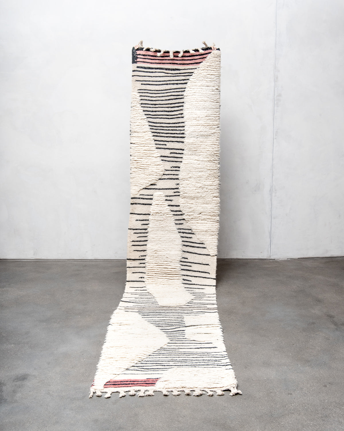 Modern, designer, handcrafted Berber runner rug from Morocco. Beniourain carpet with beautiful colours and patterns and fluffy wool texture.