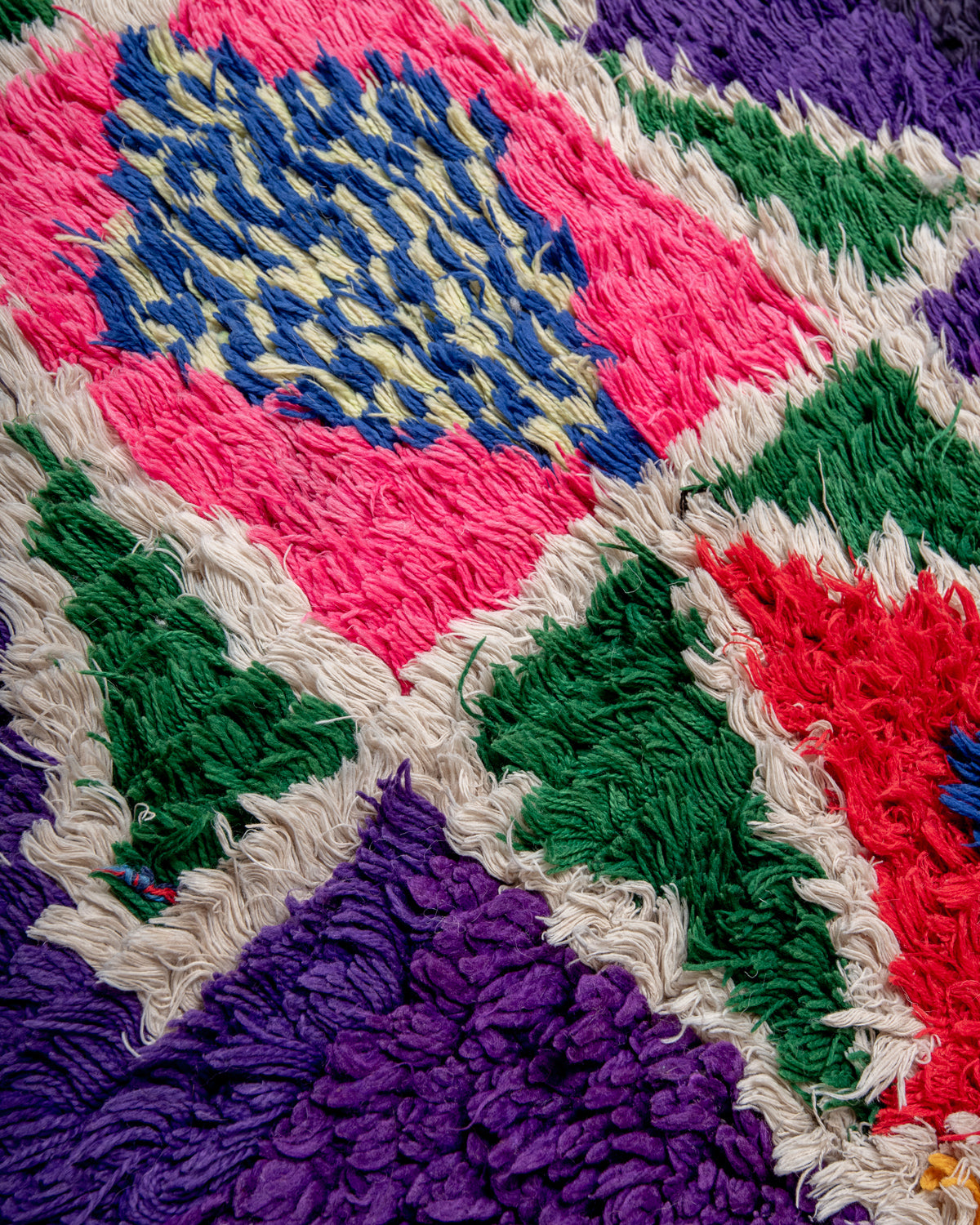 Modern designer vintage handcrafted Berber rug from Morocco. Boucherouite with beautiful colors and patterns.