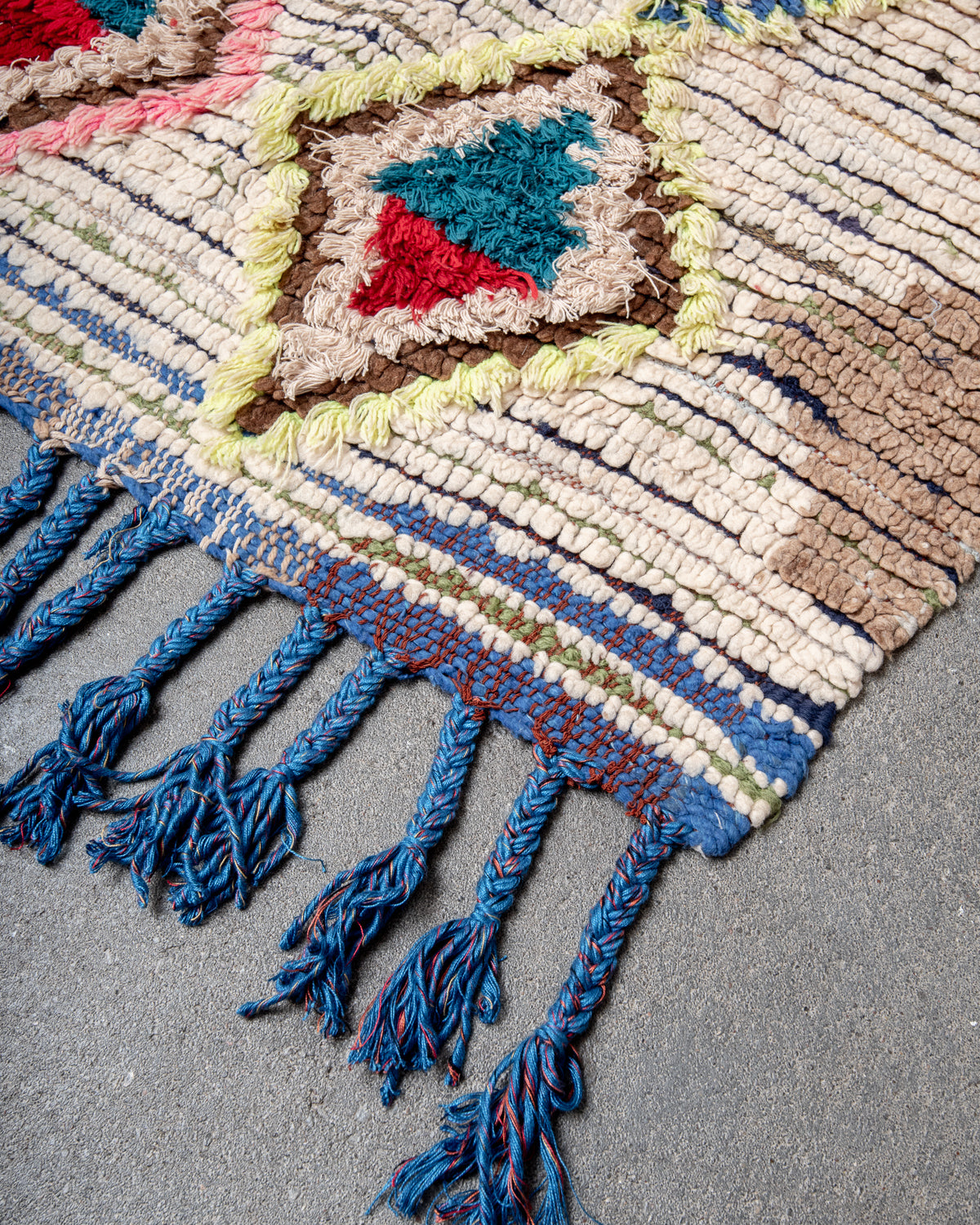 Modern designer vintage handcrafted Berber rug from Morocco. Boucherouite with beautiful colors and patterns.