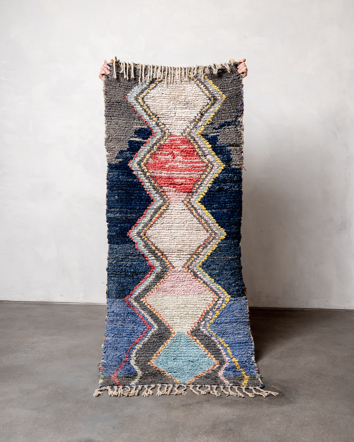 Modern designer vintage handcrafted Berber rug from Morocco. Boucherouite runner rug with beautiful colors and patterns.
