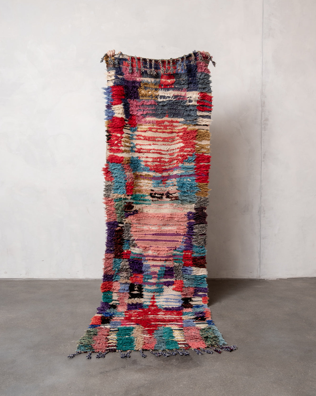 Modern designer vintage handcrafted Berber rug from Morocco. Boucherouite runner rug with beautiful colors and patterns.