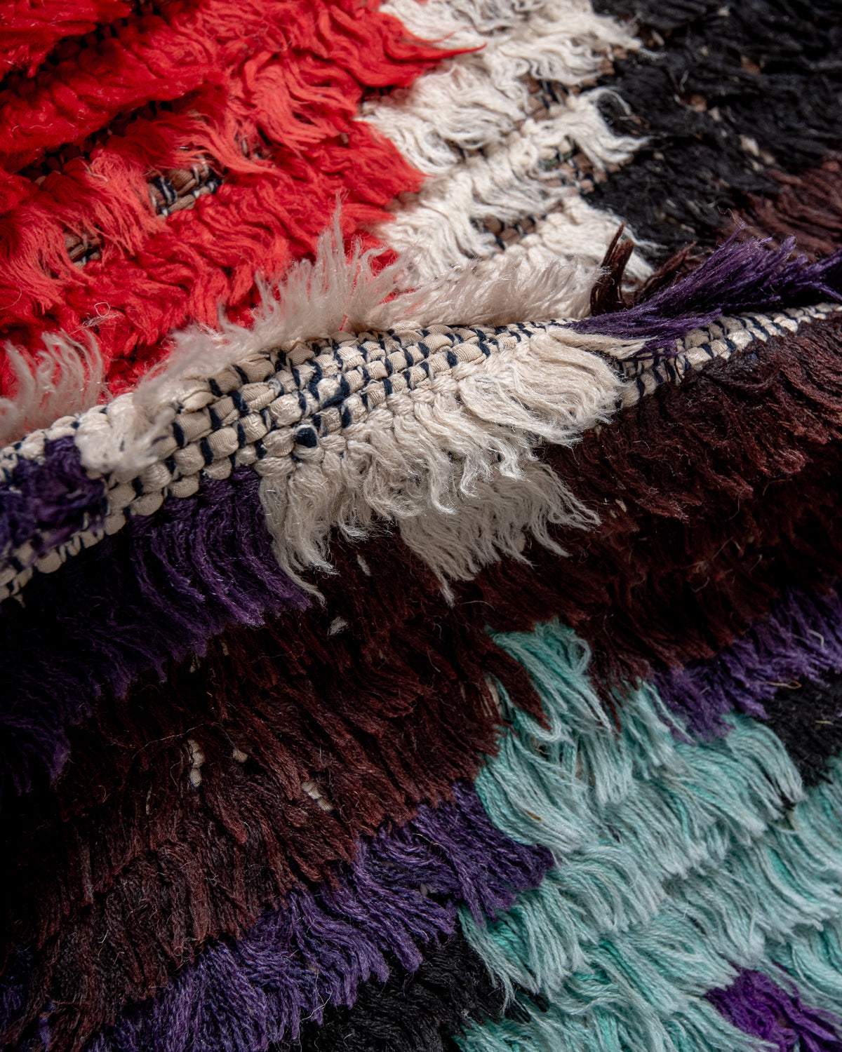 Modern designer vintage handcrafted Berber rug from Morocco. Boucherouite runner rug with beautiful colors and patterns.