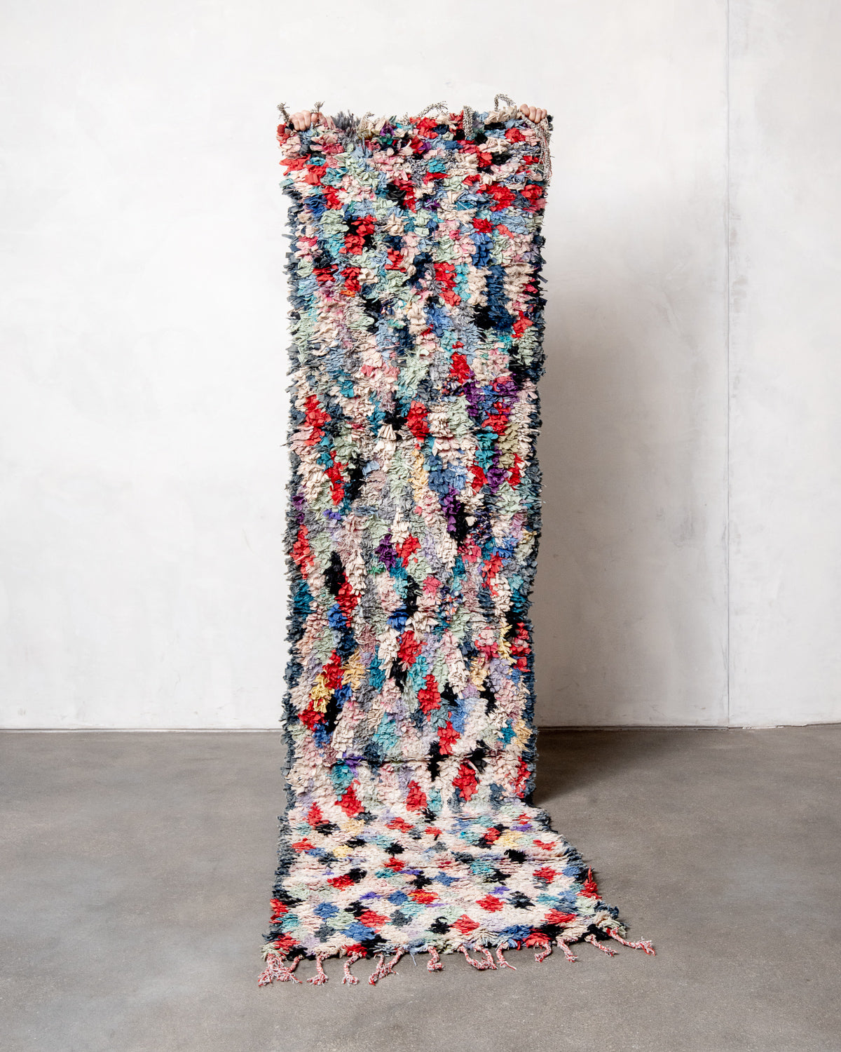 Modern designer vintage handcrafted Berber rug from Morocco. Boucherouite runner rug with beautiful colors and patterns.