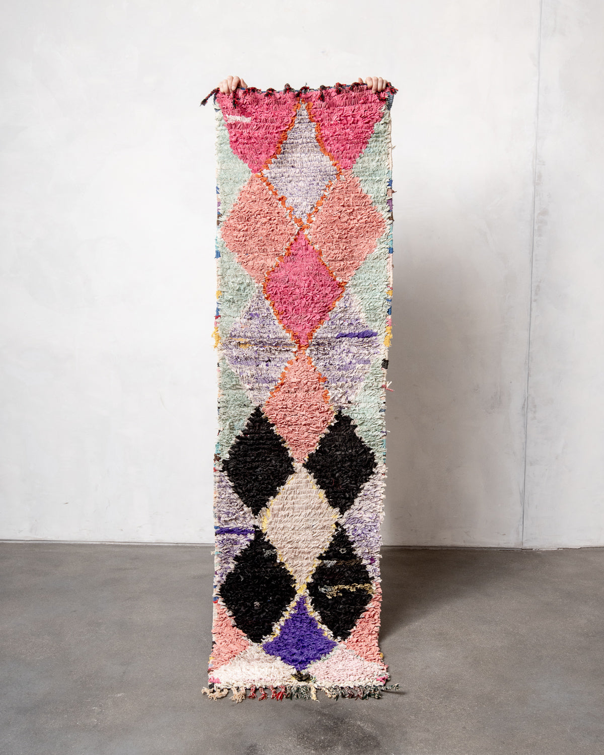 Modern designer vintage handcrafted Berber rug from Morocco. Boucherouite runner rug with beautiful colors and patterns.
