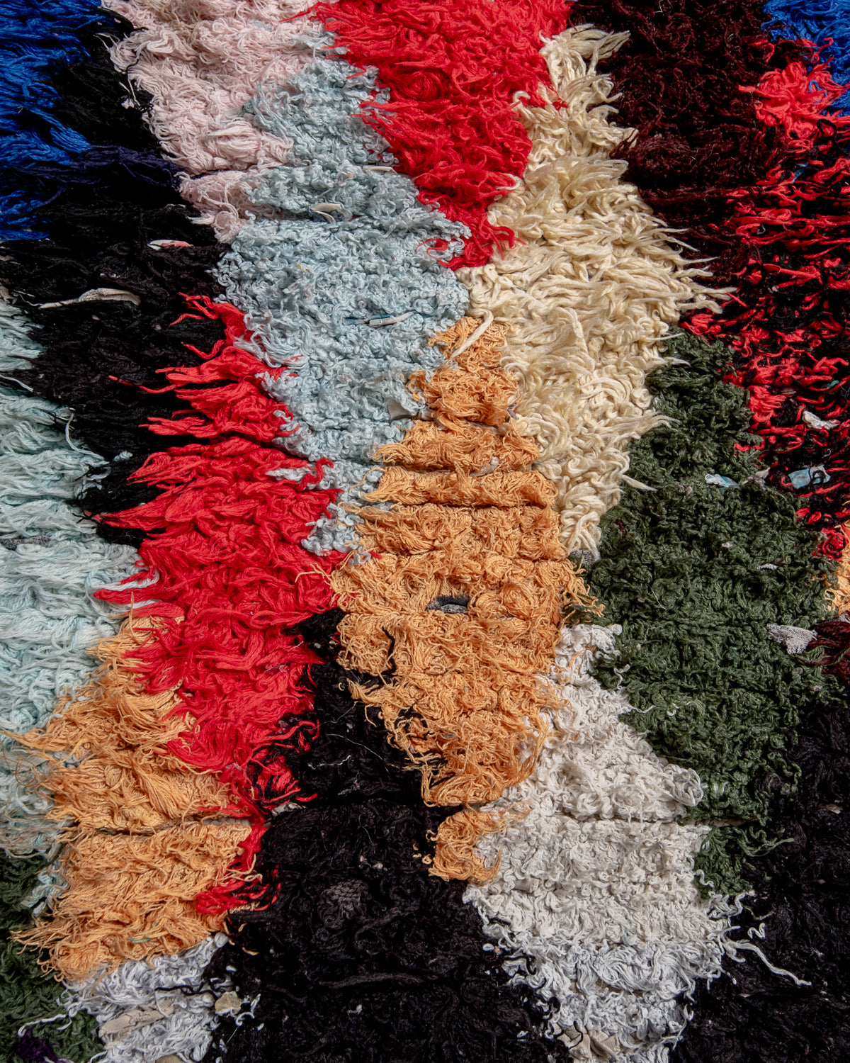 Modern designer vintage handcrafted Berber rug from Morocco. Boucherouite with beautiful colors and patterns.