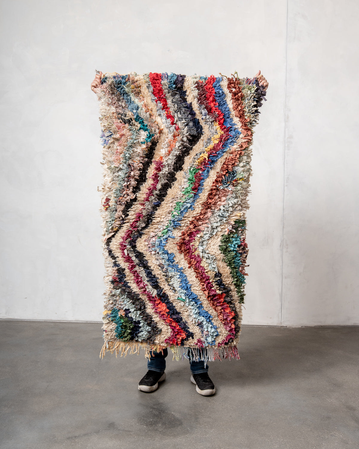 Modern designer vintage handcrafted Berber rug from Morocco. Boucherouite with beautiful colors and patterns.