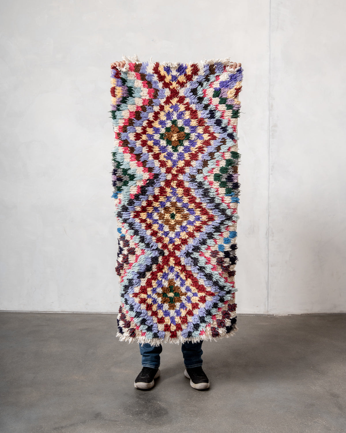 Modern designer vintage handcrafted Berber rug from Morocco. Boucherouite with beautiful colors and patterns.