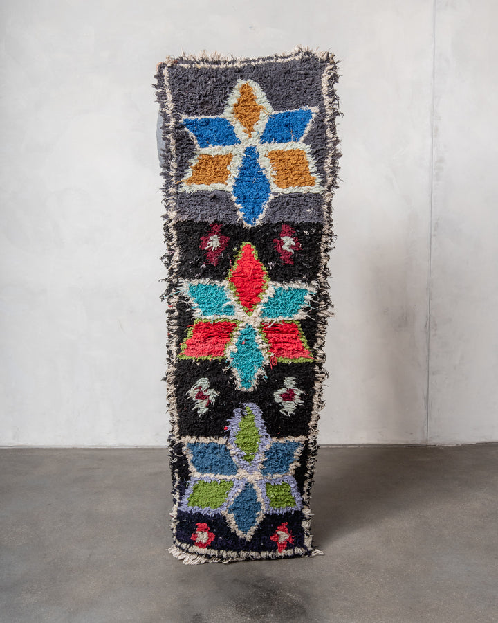 Modern designer vintage handcrafted Berber rug from Morocco. Boucherouite with beautiful colors and patterns.