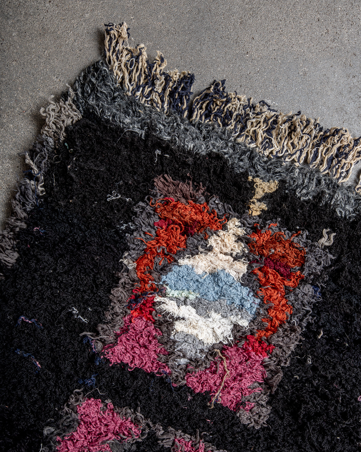 Modern designer vintage handcrafted Berber rug from Morocco. Boucherouite with beautiful colors and patterns.