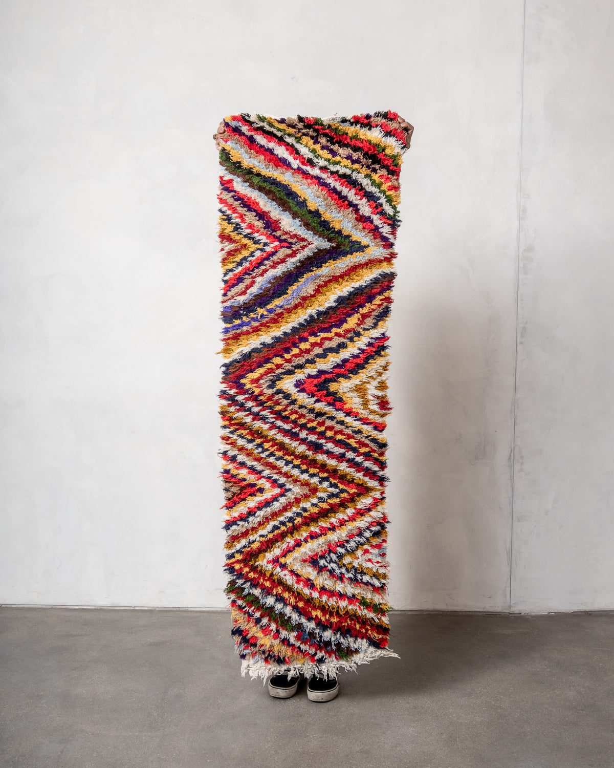 Modern designer vintage handcrafted Berber rug from Morocco. Boucherouite runner rug with beautiful colors and patterns.