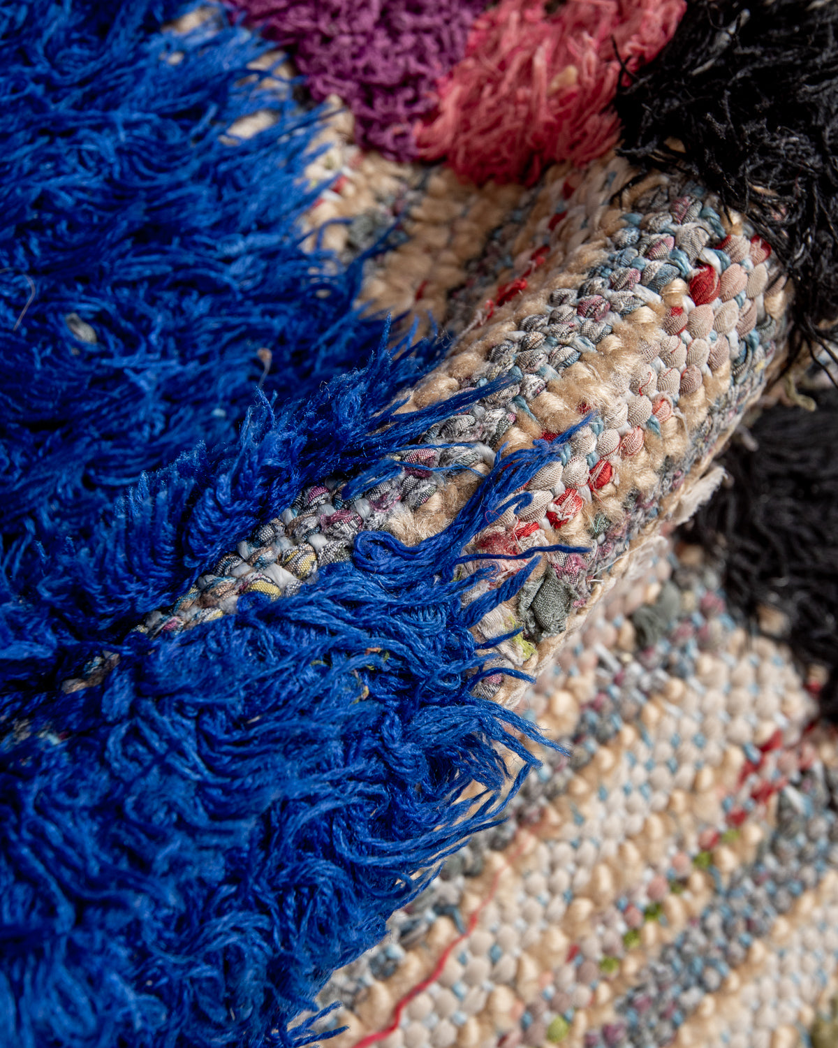 Modern designer vintage handcrafted Berber rug from Morocco. Boucherouite runner rug with beautiful colors and patterns.