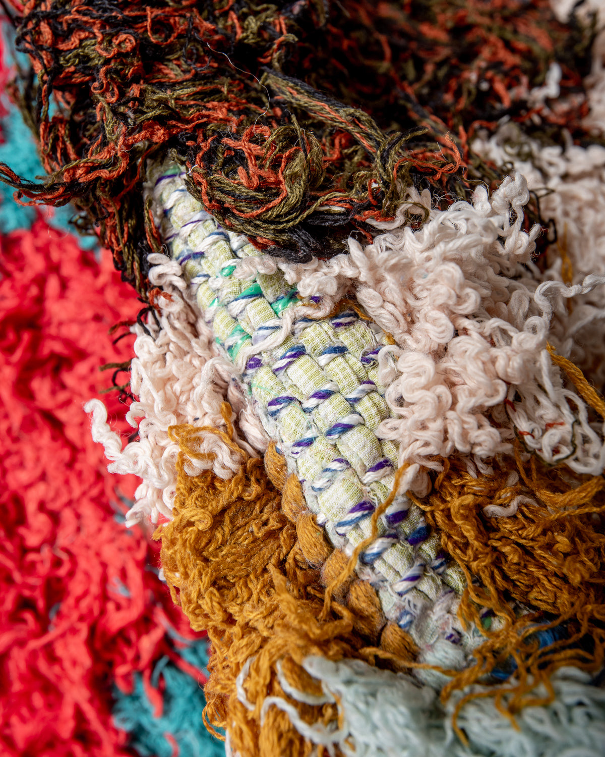 Modern designer vintage handcrafted Berber rug from Morocco. Boucherouite runner rug with beautiful colors and patterns.