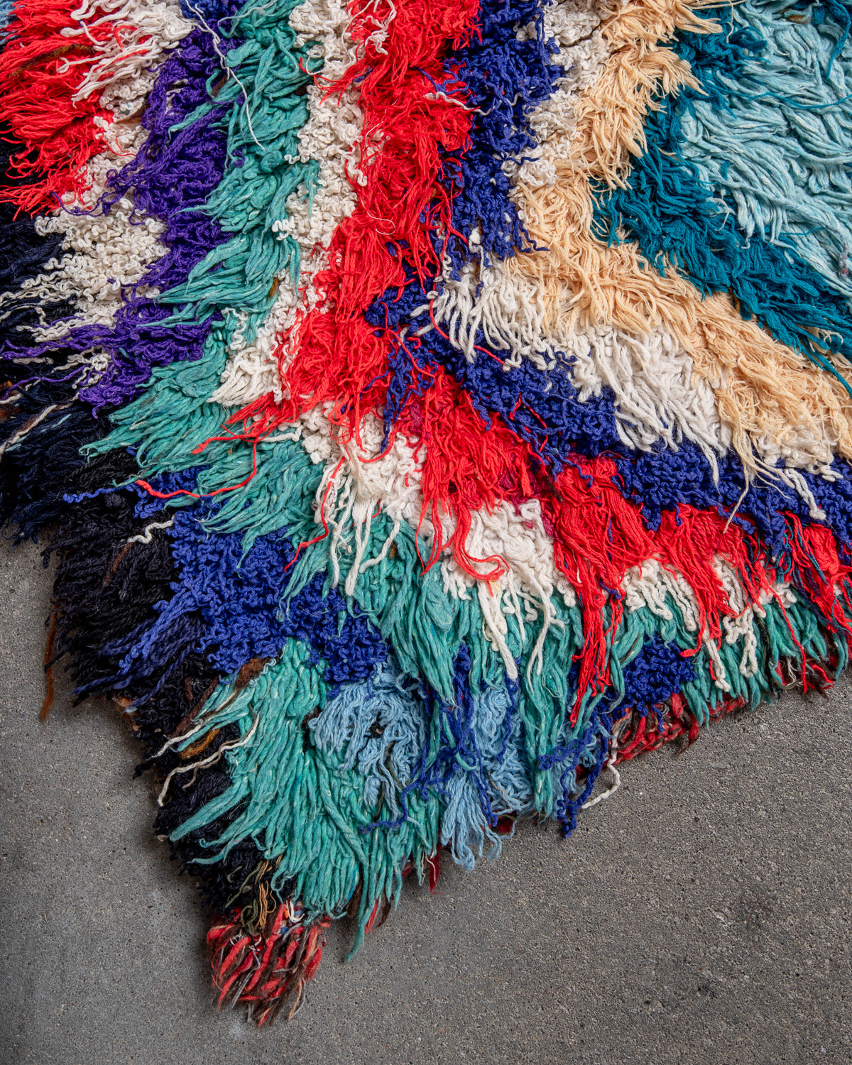 Modern designer vintage handcrafted Berber rug from Morocco. Boucherouite runner rug with beautiful colors and patterns.