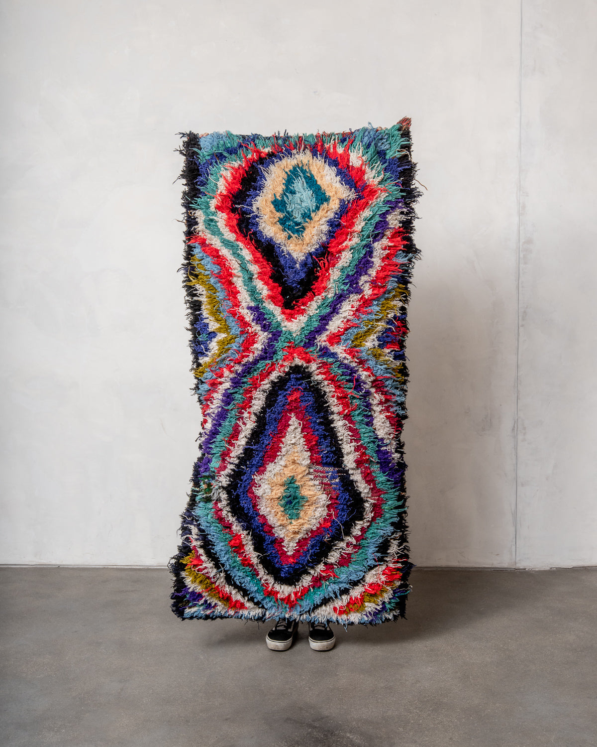Modern designer vintage handcrafted Berber rug from Morocco. Boucherouite runner rug with beautiful colors and patterns.