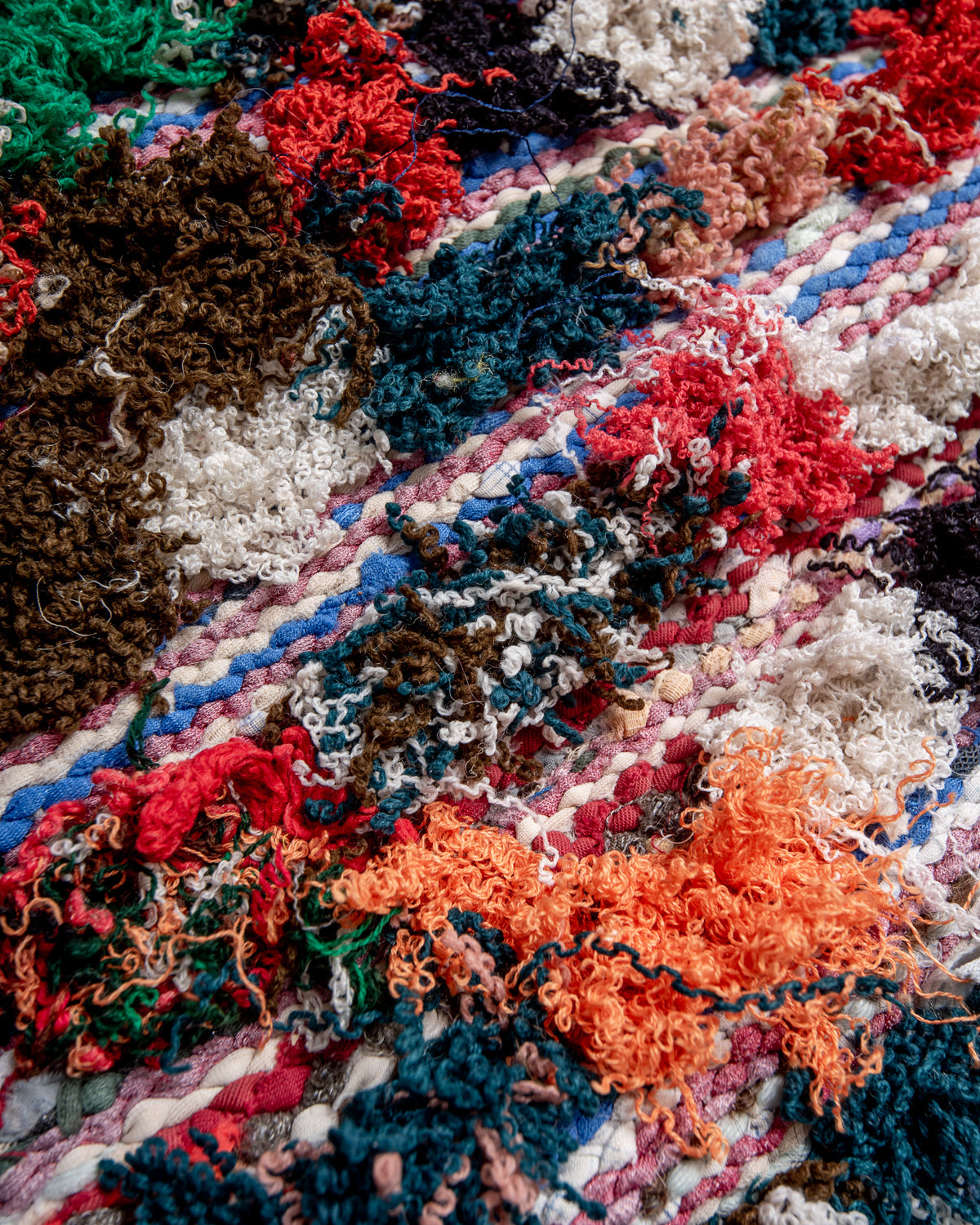 Modern designer vintage handcrafted Berber rug from Morocco. Boucherouite runner rug with beautiful colors and patterns.