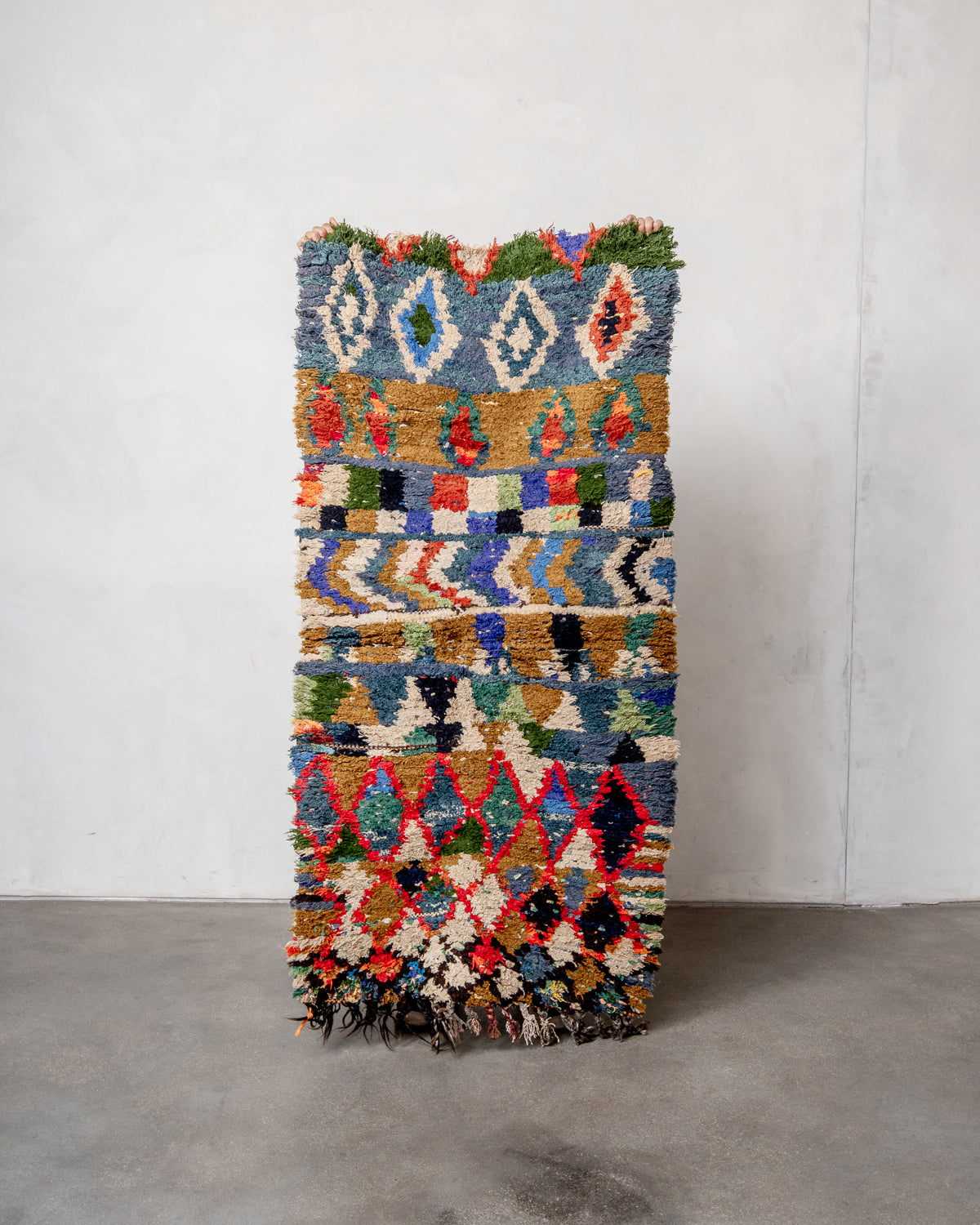 Modern designer vintage handcrafted Berber rug from Morocco. Boucherouite with beautiful colors and patterns.