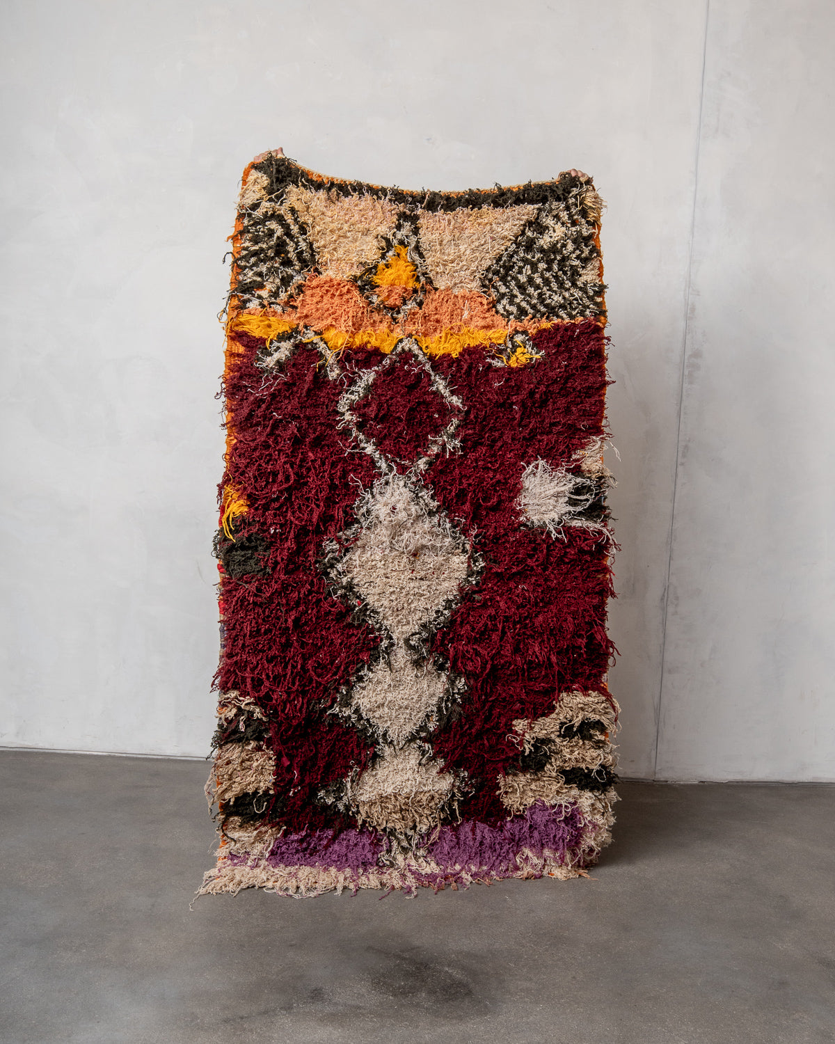 Modern designer vintage handcrafted Berber rug from Morocco. Boucherouite with beautiful colors and patterns.
