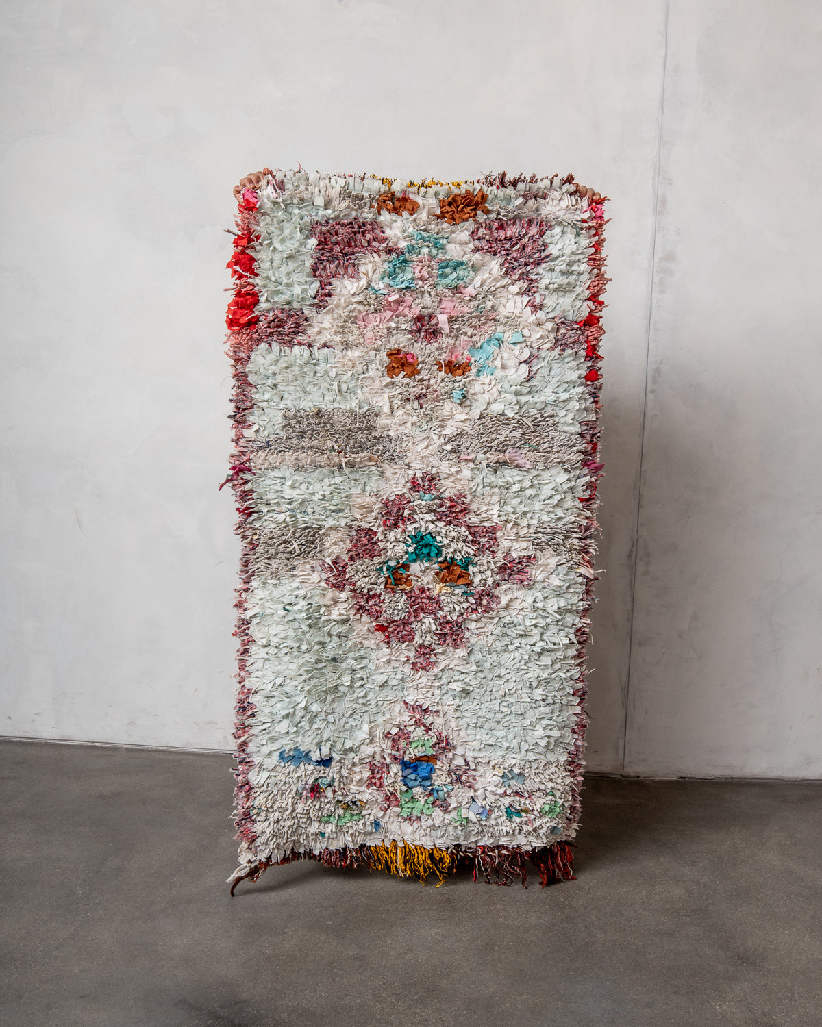 Modern designer vintage handcrafted Berber rug from Morocco. Boucherouite with beautiful colors and patterns.