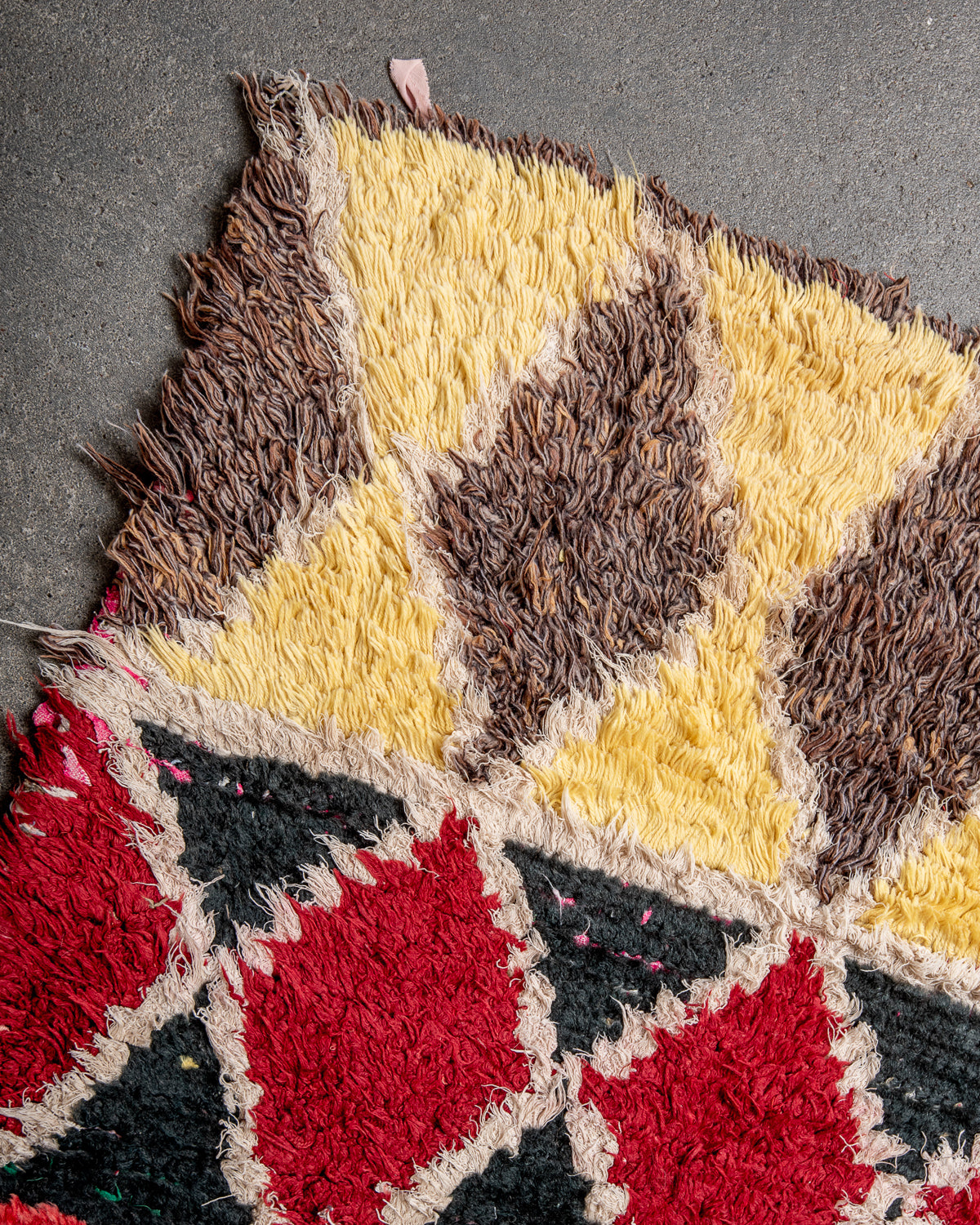 Modern designer vintage handcrafted Berber rug from Morocco. Boucherouite with beautiful colors and patterns.