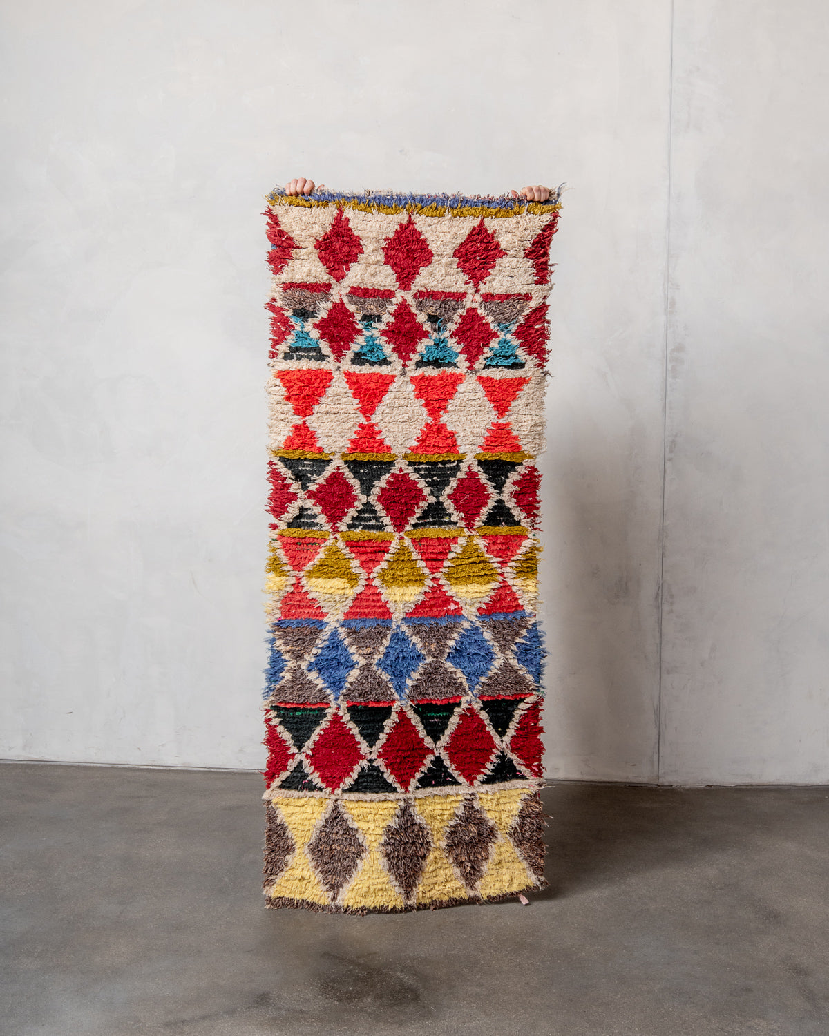 Modern designer vintage handcrafted Berber rug from Morocco. Boucherouite with beautiful colors and patterns.