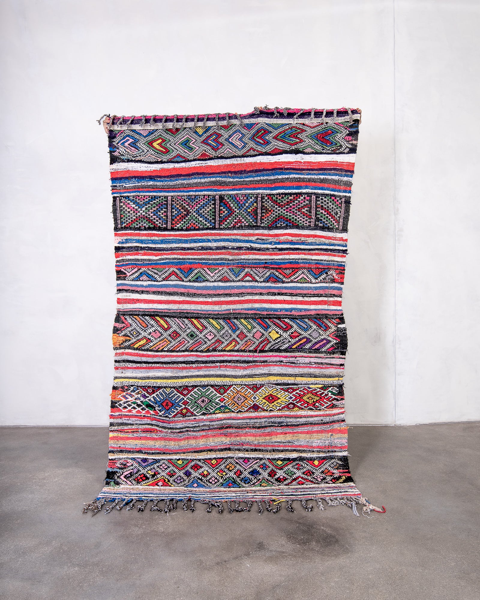 Modern, designer, handcrafted Berber rug from Morocco. Kelim carpet with beautiful colours and patterns and fluffy wool texture.