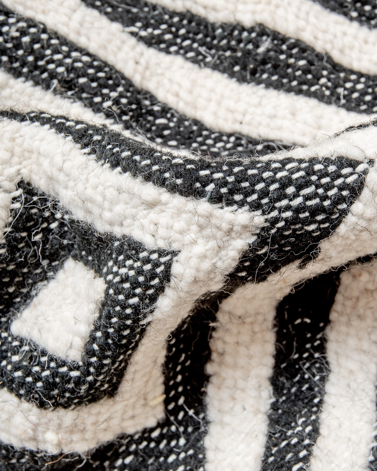 Modern, handcrafted Berber rug from Morocco. Flat-woven Kelim carpet in black and white design. Made of 100% wool.