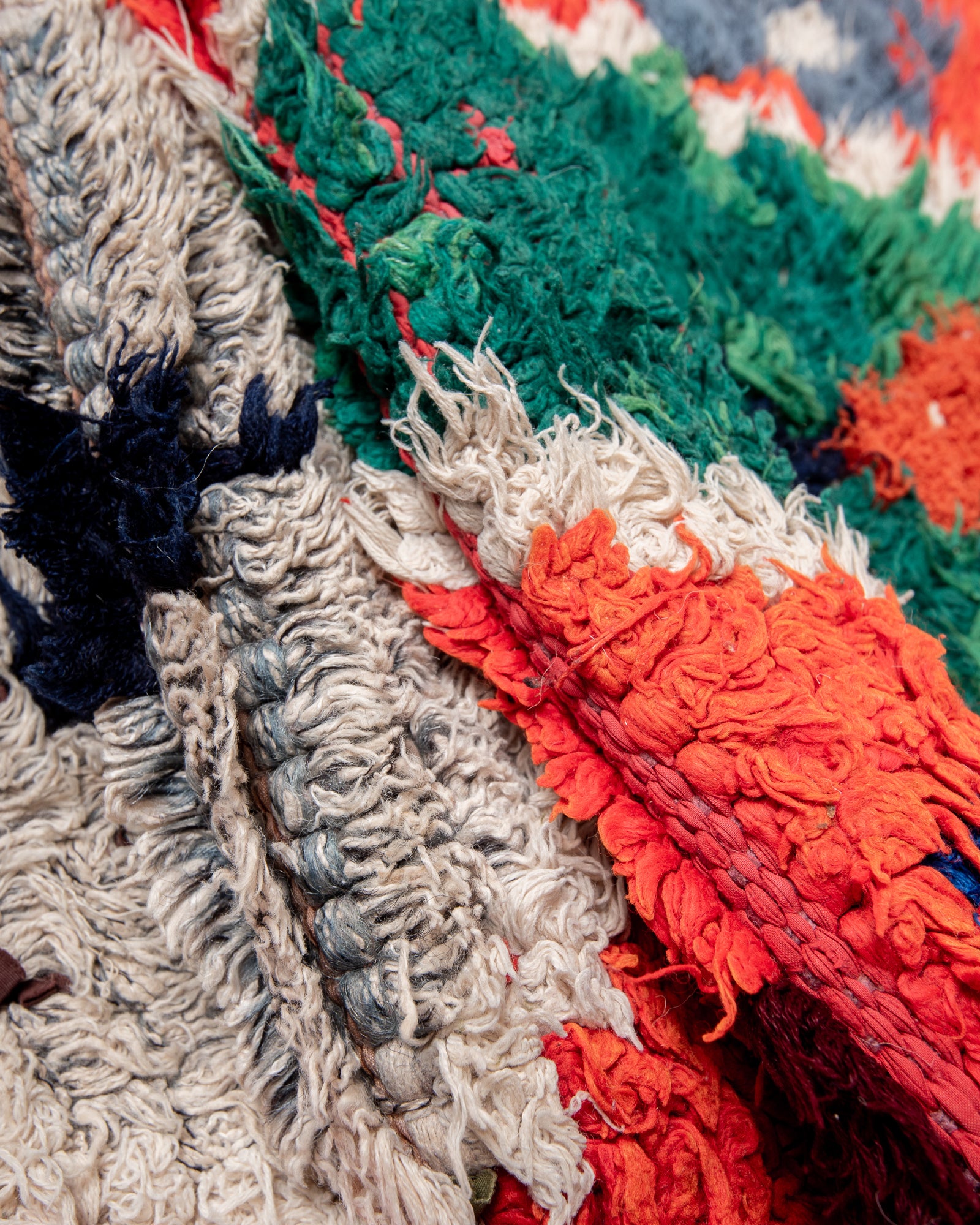 Modern, designer, handcrafted Berber rug from Morocco. Boucherouite carpet with beautiful colours and patterns and fluffy wool texture.